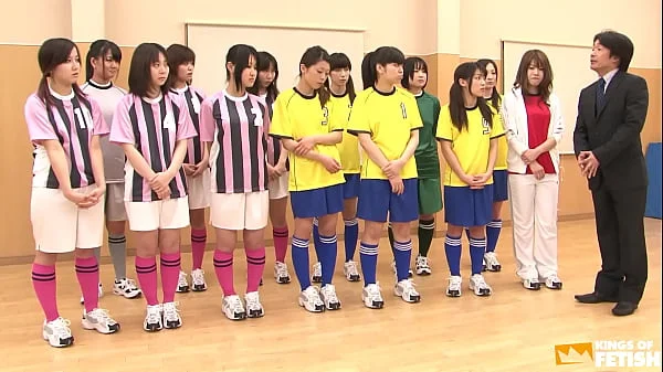 Japanese female team listen and take a lesson from their coach